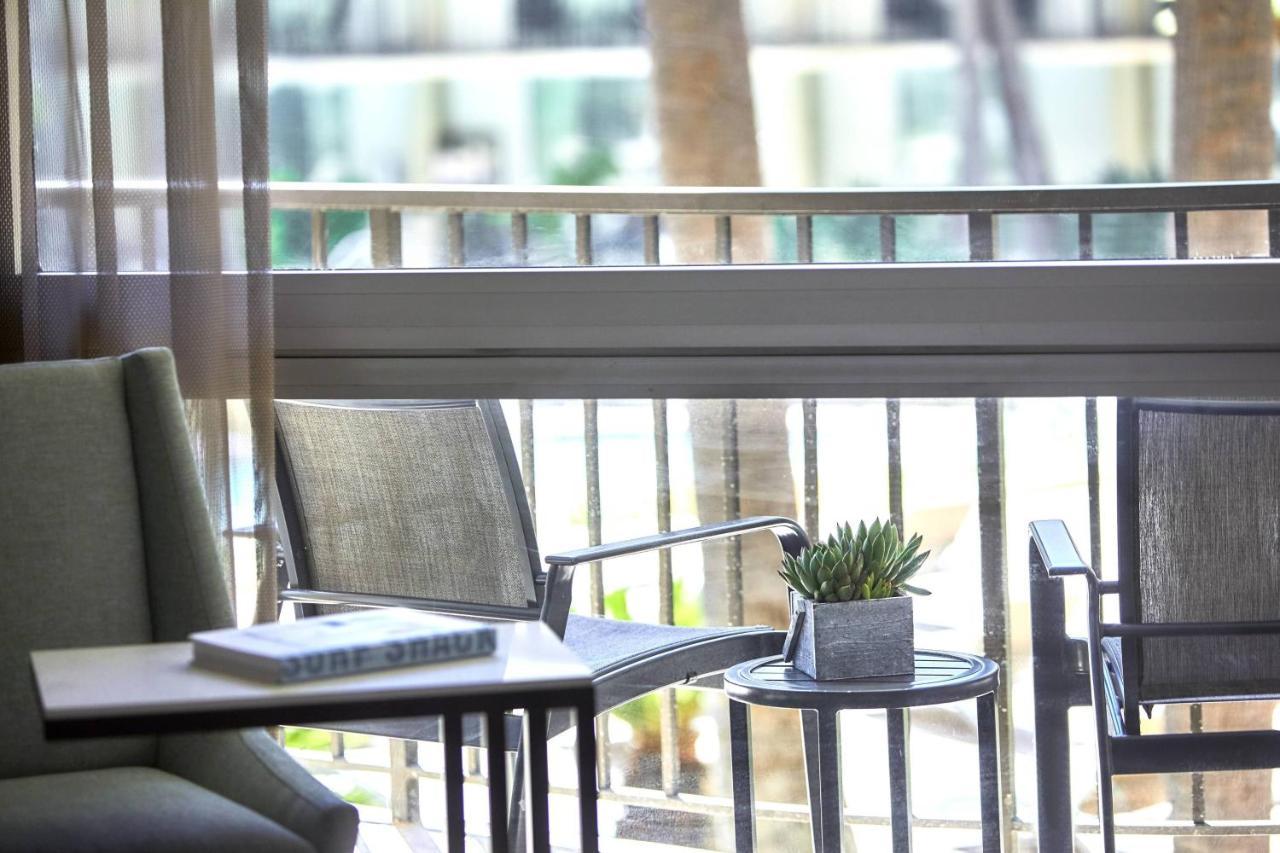 Guest Room Two Double Beds Balcony Pool View