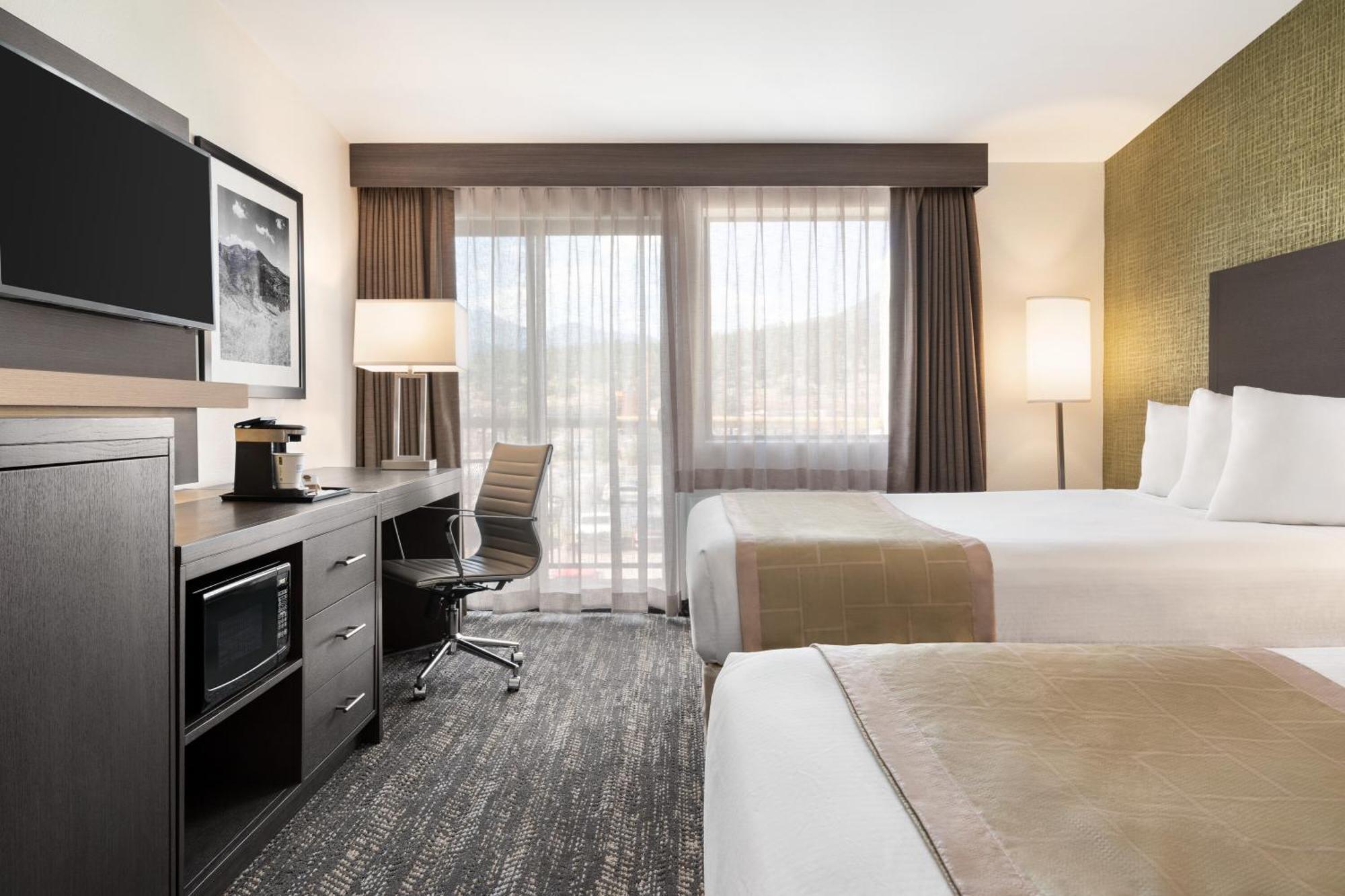 Quadruple Room Two Queen Beds Balcony Non Smoking