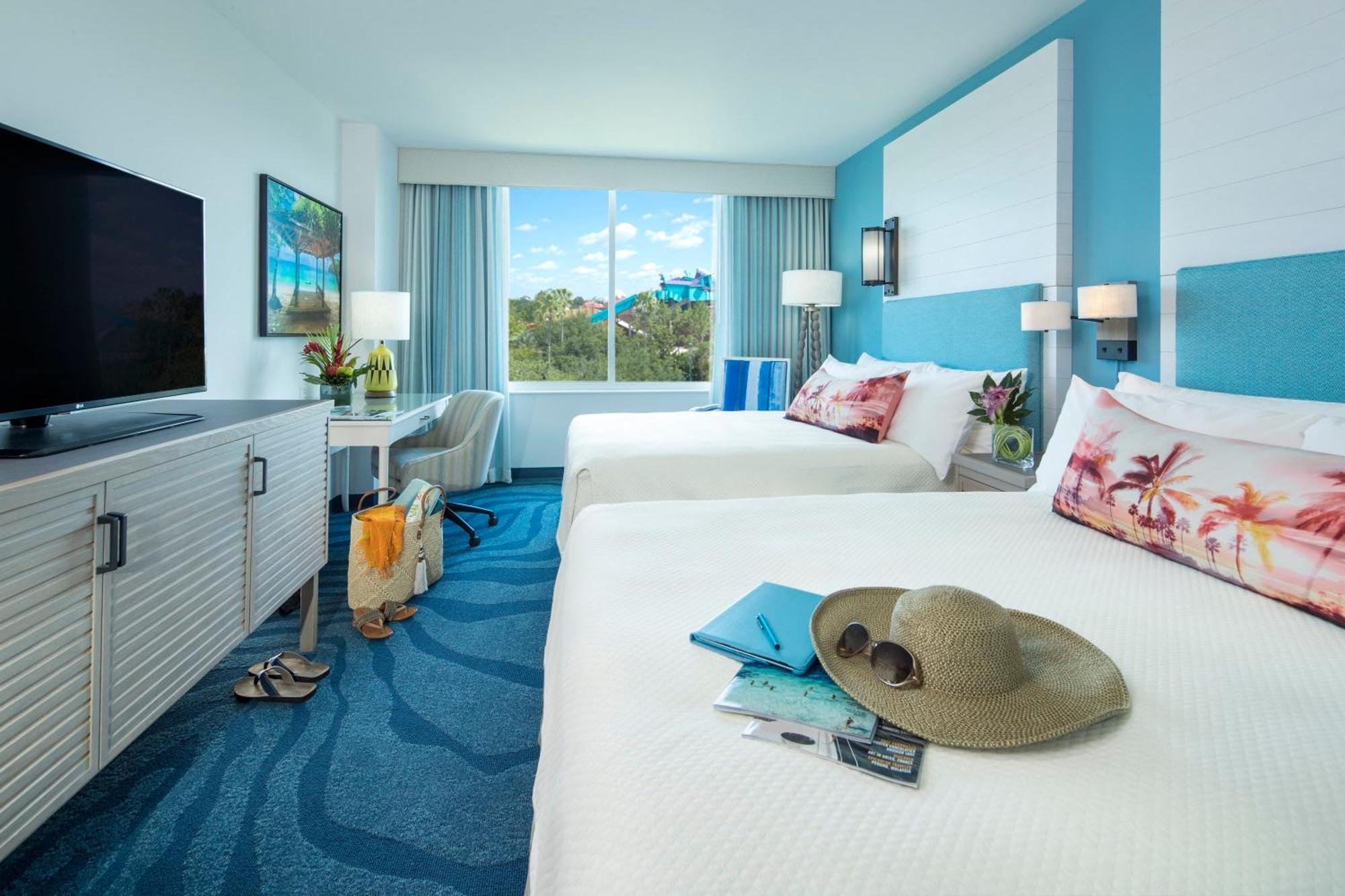 Mobility or Hearing Accessible Pool View 2 Queen Room w or ADA tub Includes Early Park Admission*