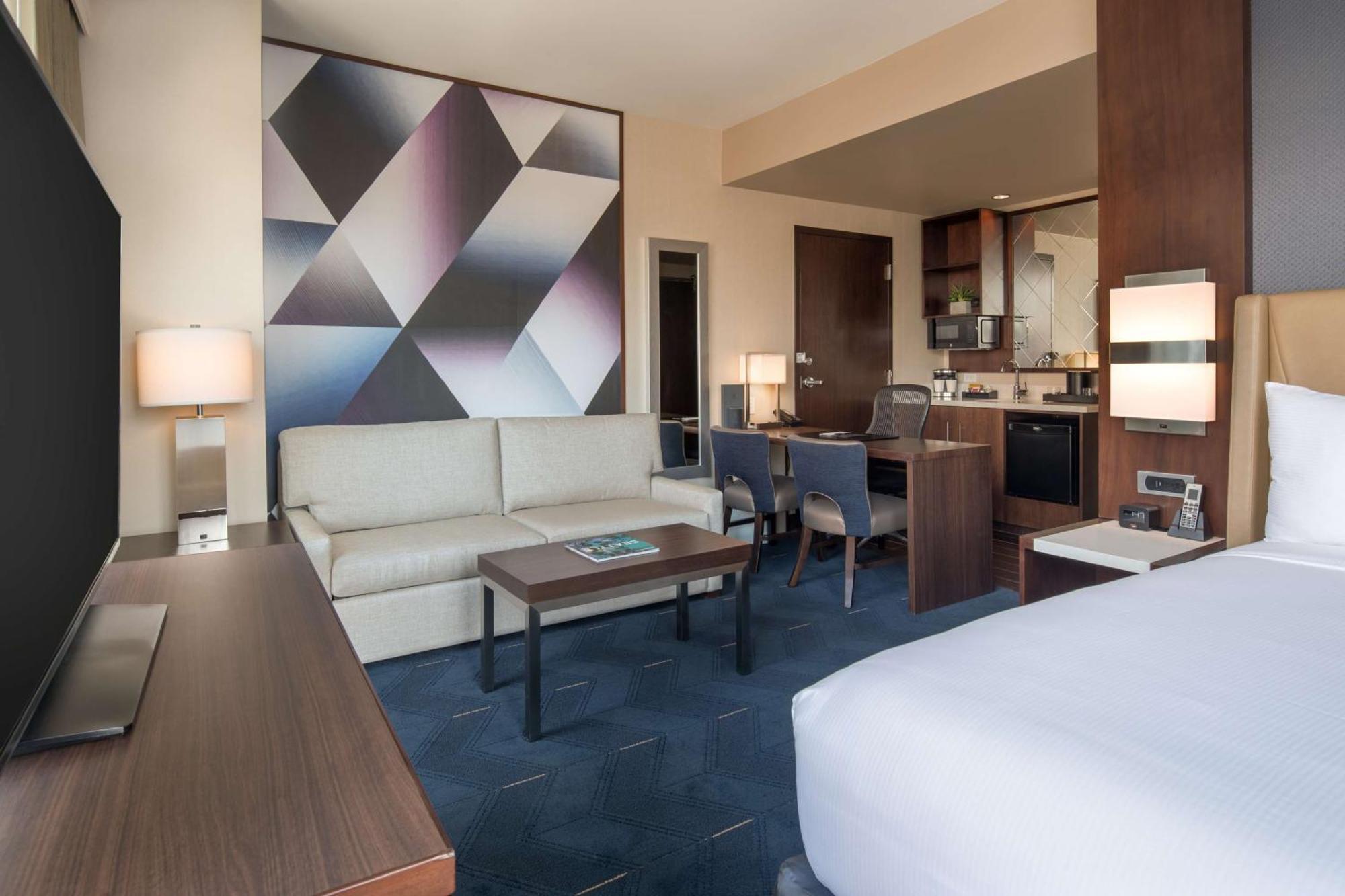 Corner Studio Suite One King Bed Sofa Bed Stadium View