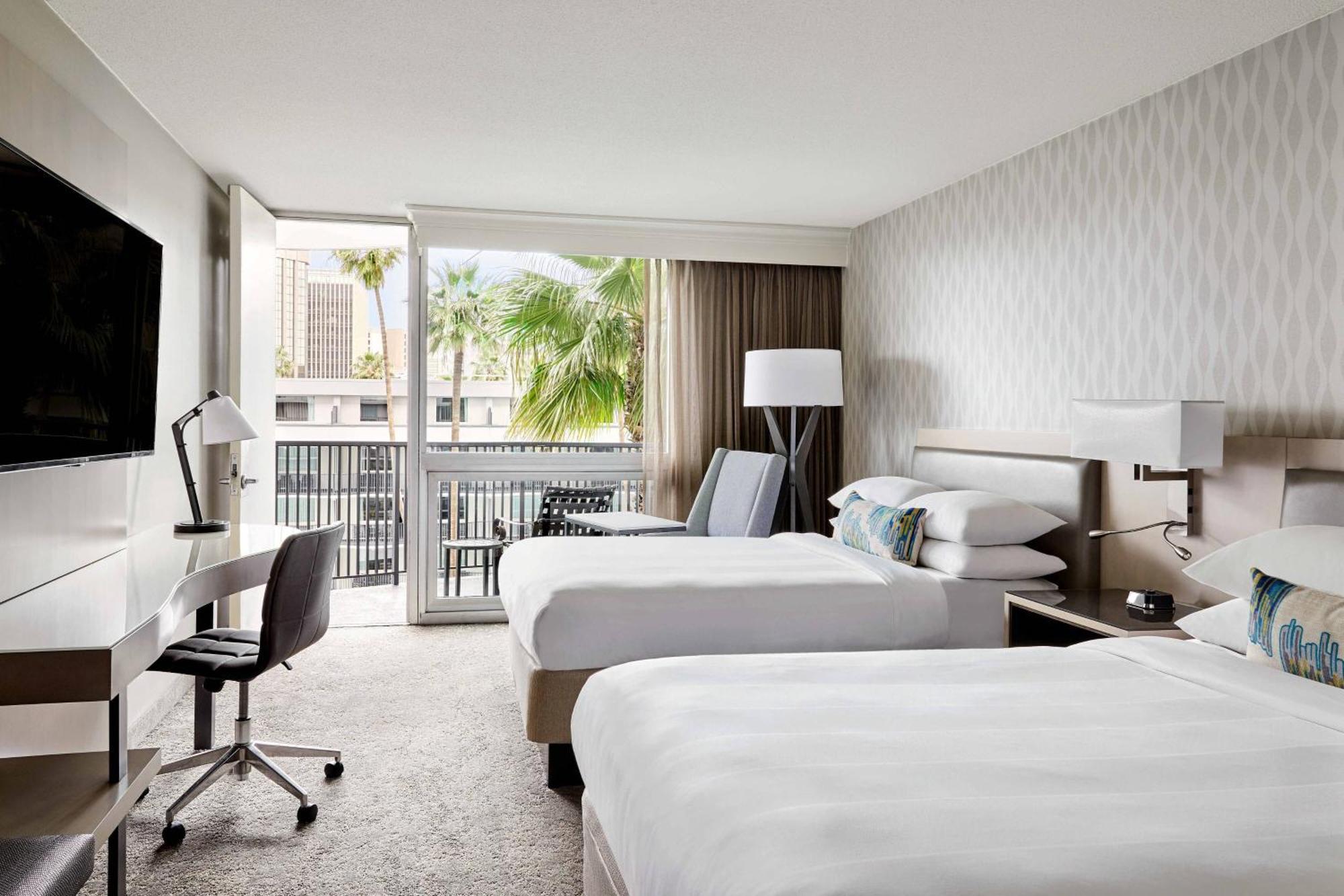 Guest Room Two Double Beds Balcony Pool View