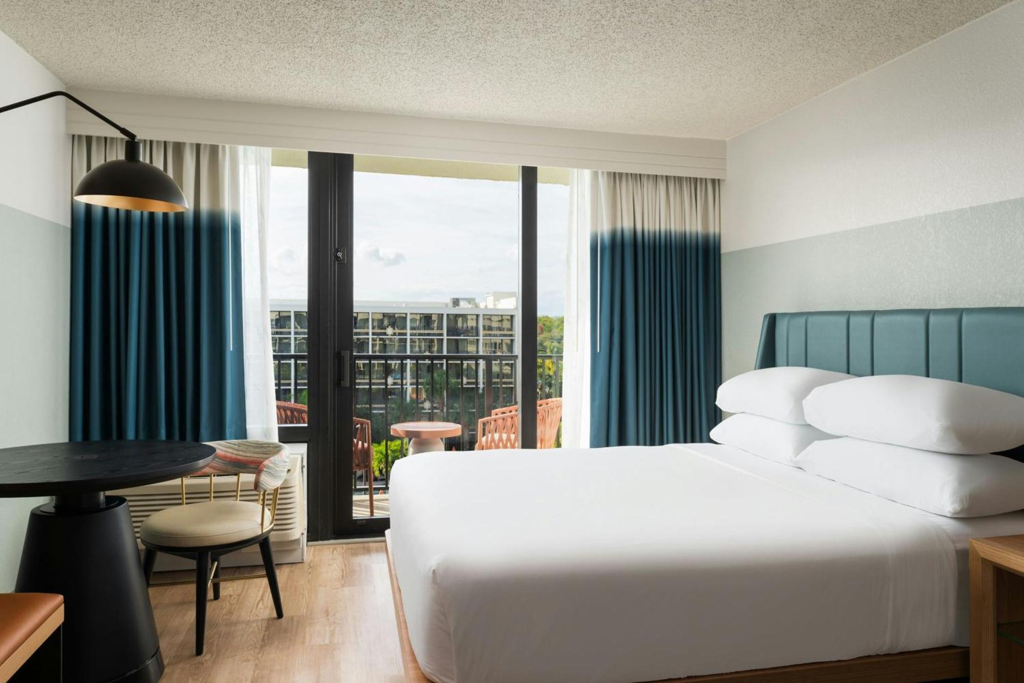 One-Bedroom King Suite Sofa Bed Pool View Mobility Accessible Roll Shower