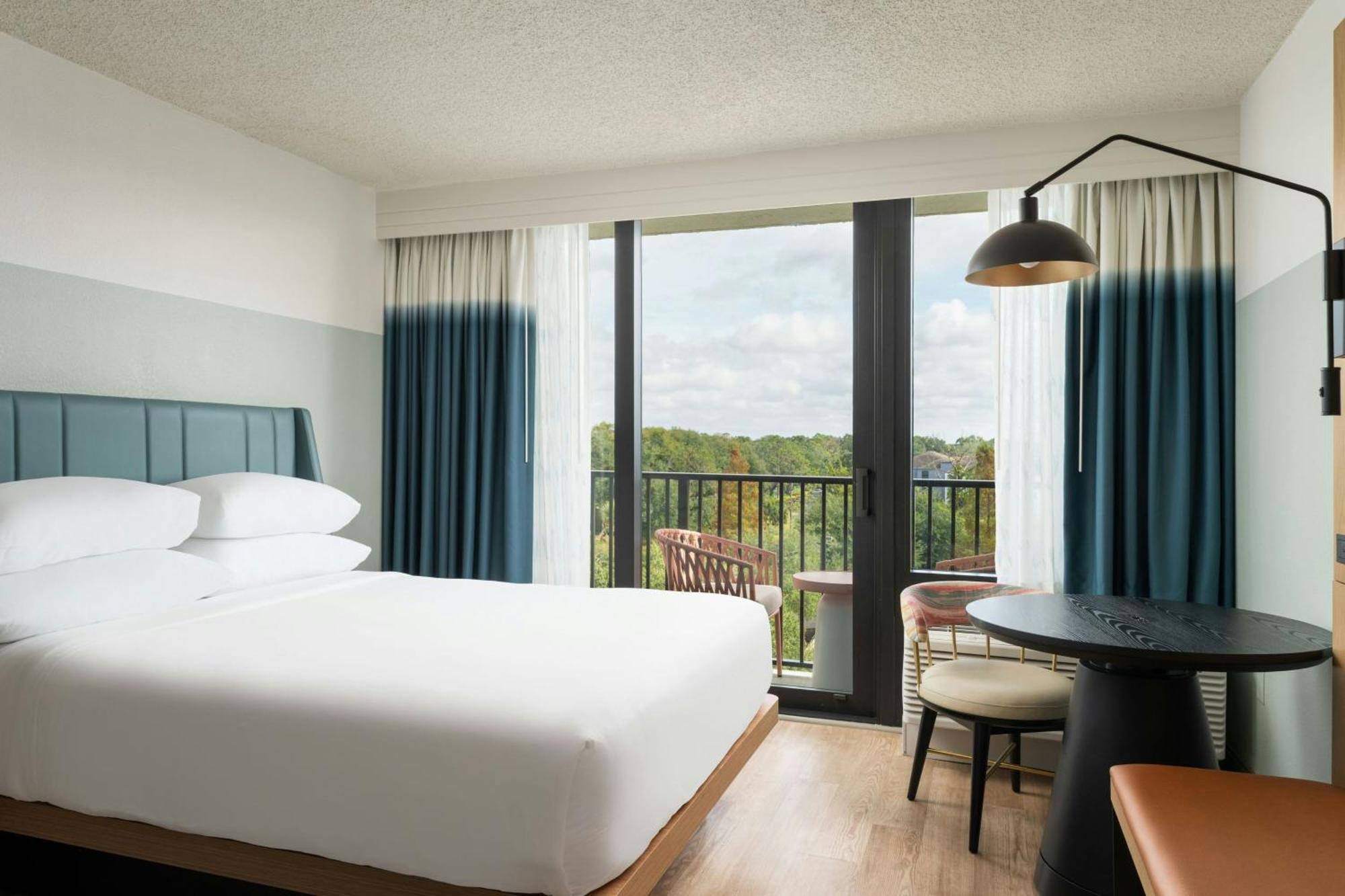 One-Bedroom King Suite Sofa Bed Pool View Mobility Accessible Roll Shower