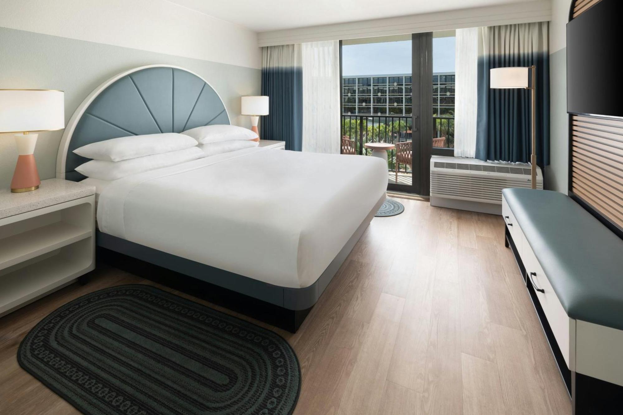One-Bedroom King Suite Sofa Bed Pool View Mobility Accessible Roll Shower