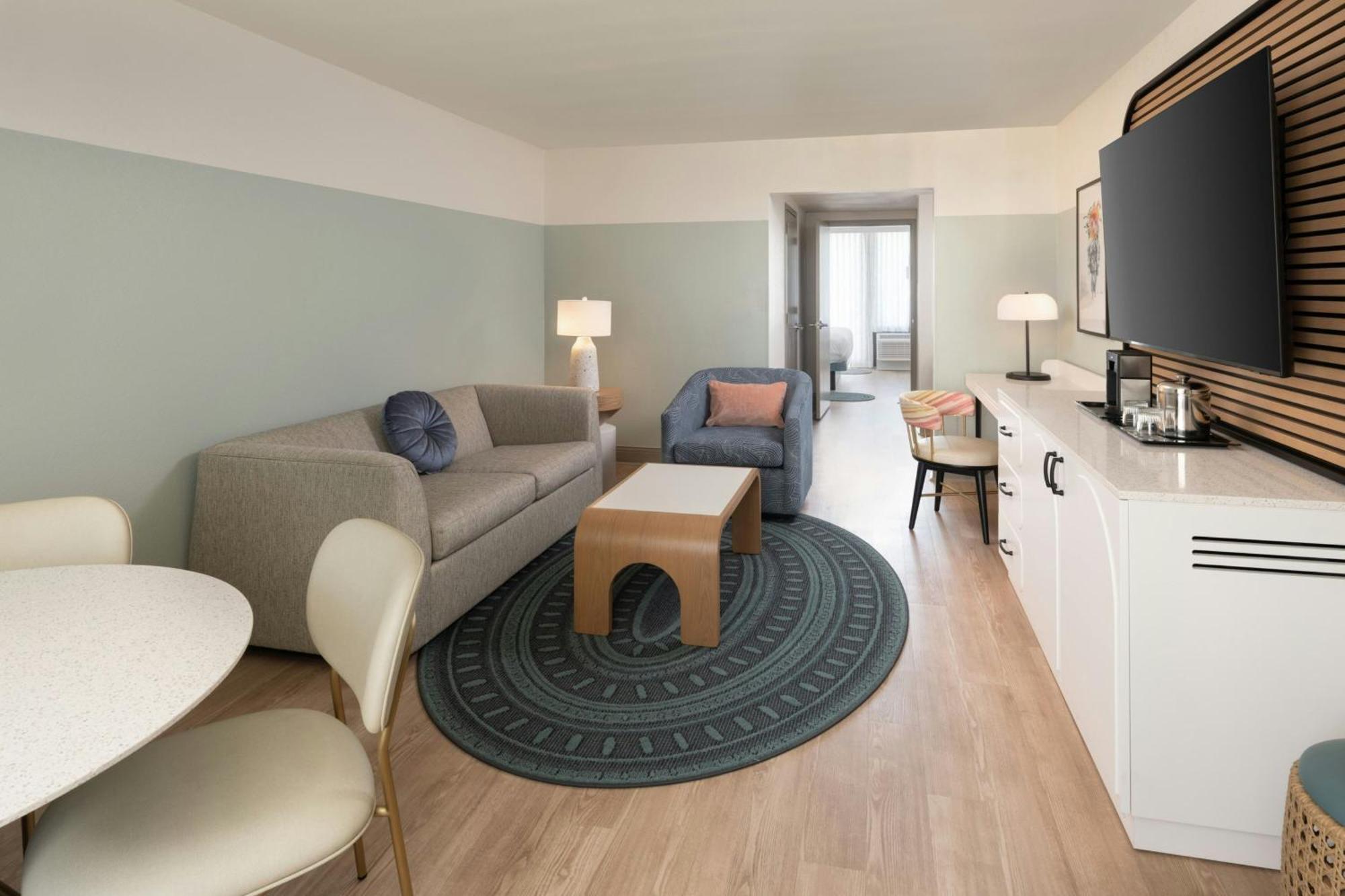 One-Bedroom King Suite Sofa Bed Pool View Mobility Accessible Roll Shower
