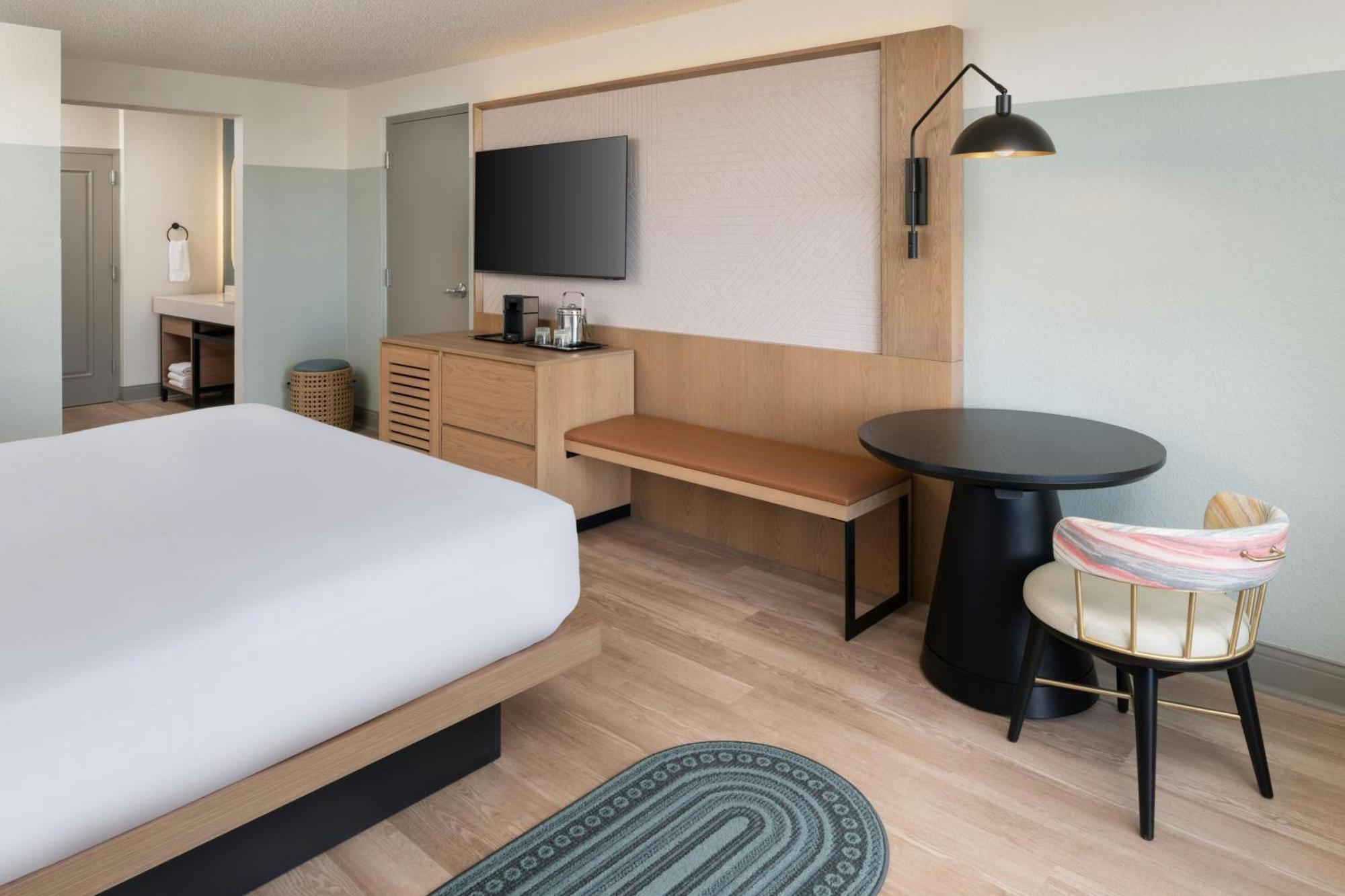 One-Bedroom King Suite Sofa Bed Pool View Mobility Accessible Roll Shower