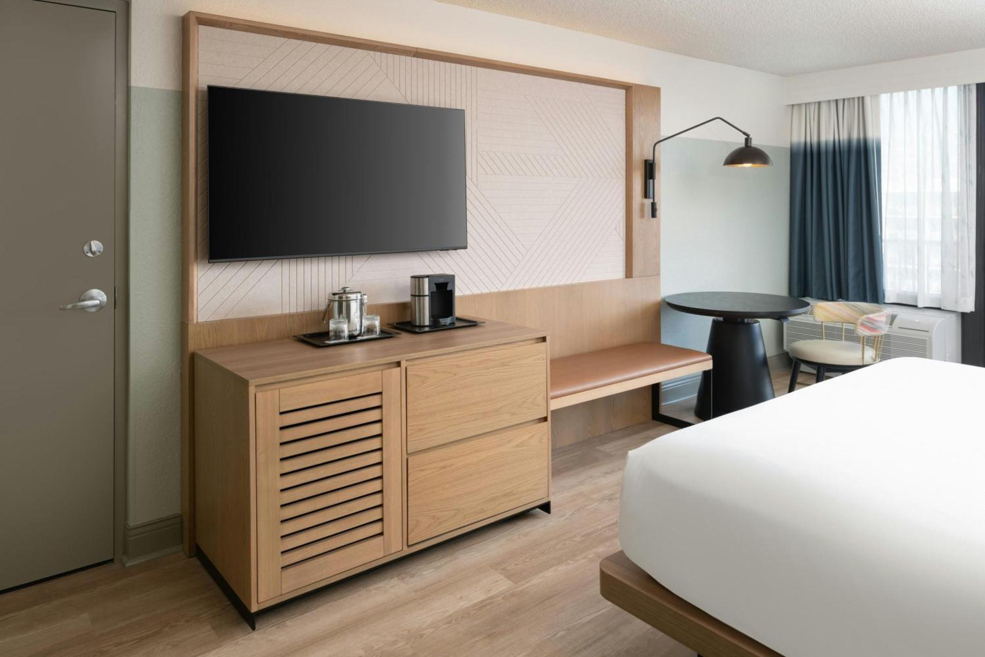 One-Bedroom King Suite Sofa Bed Pool View Mobility Accessible Roll Shower