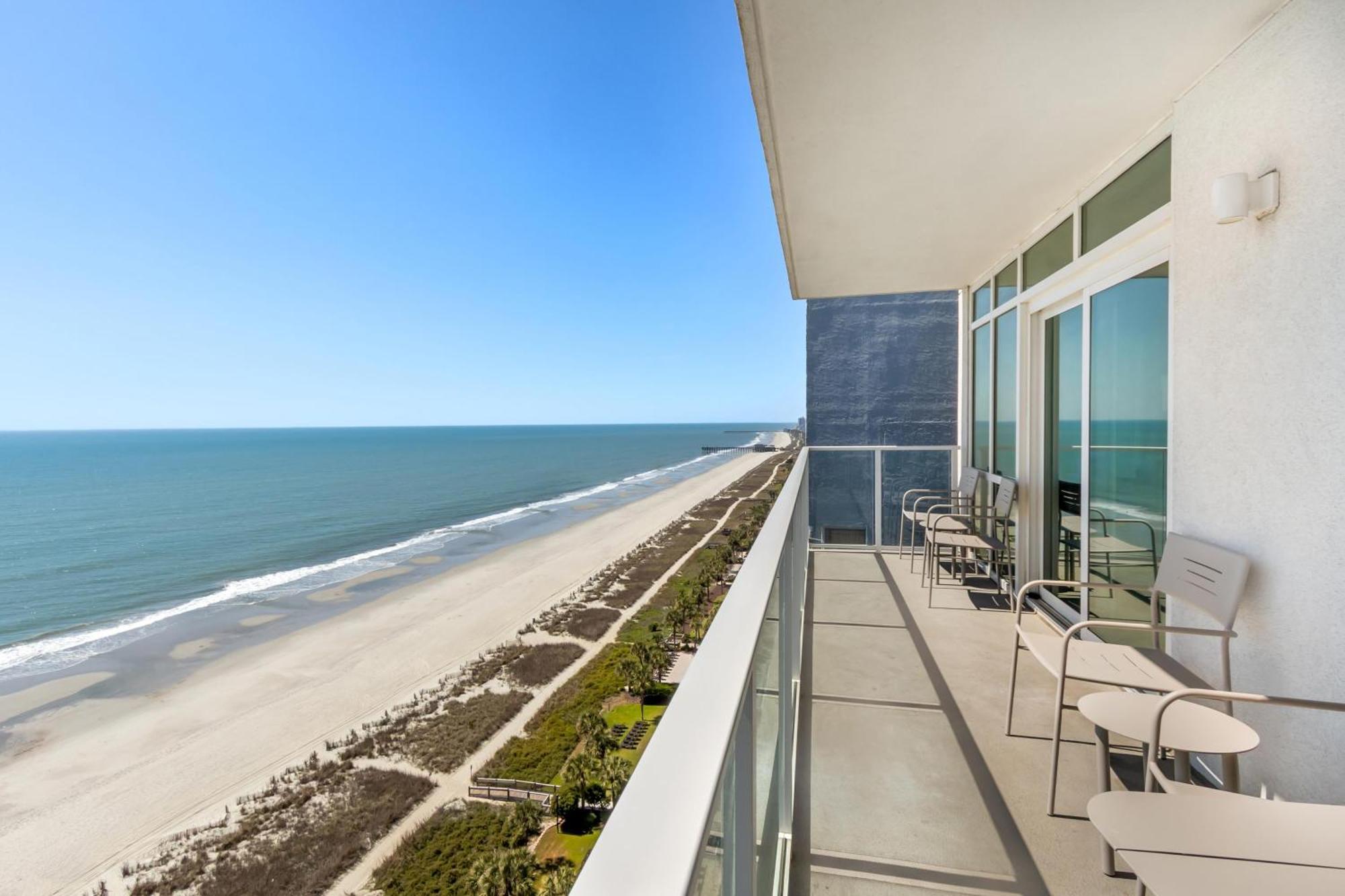 Three-Bedroom Oceanfront Suite One King Bed Three Queen Beds Roll Shower Mobility Access