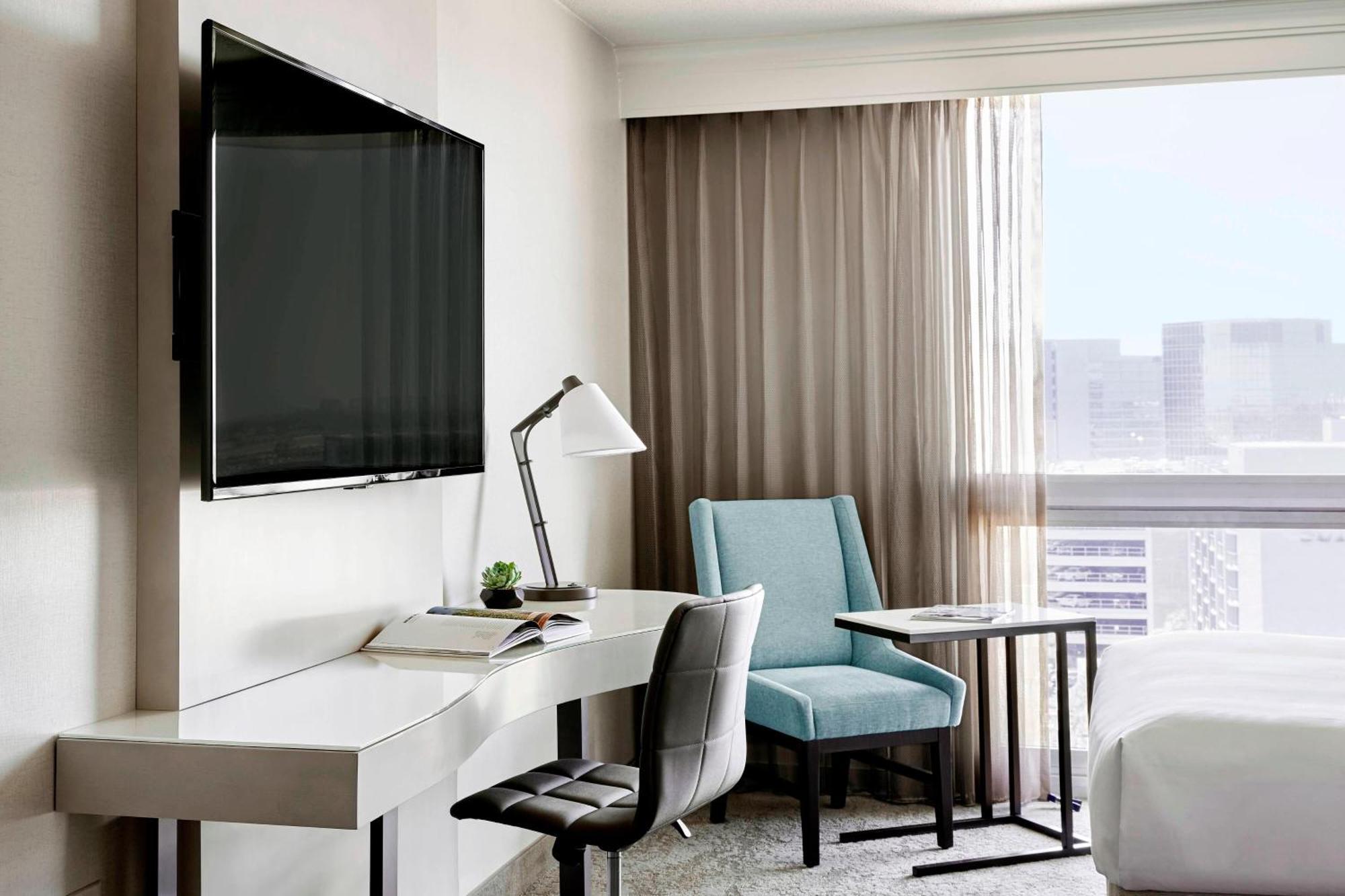 Guest Room Two Double Beds Balcony Pool View